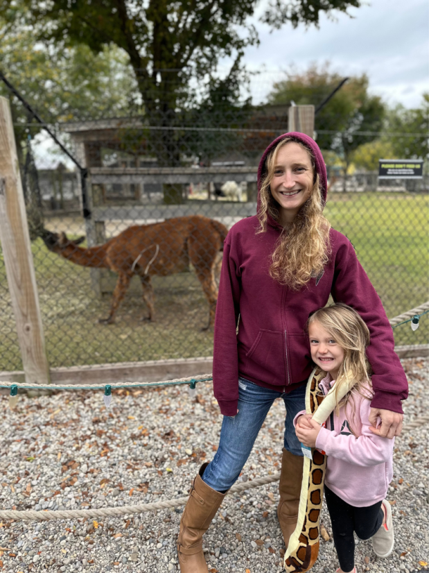 Mom and daughter standing in front of llamas at Ararat Ridge Zoo at Ark Encounter in Williamstown, KY