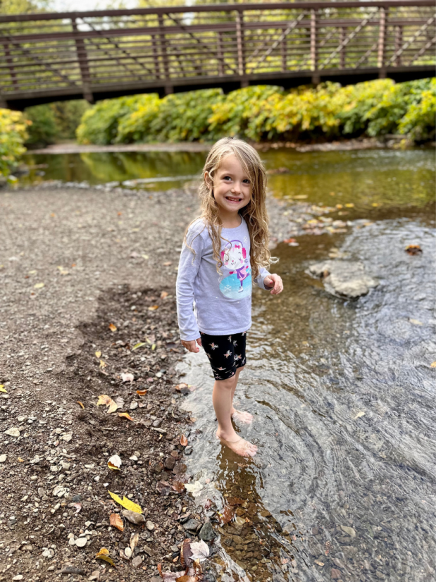 Girl standing in creek