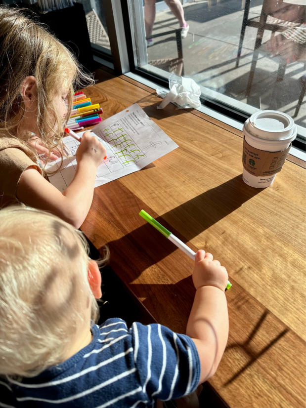 Five year old doing homeschool at Starbucks