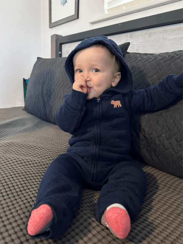 Baby boy in blue bear bunting