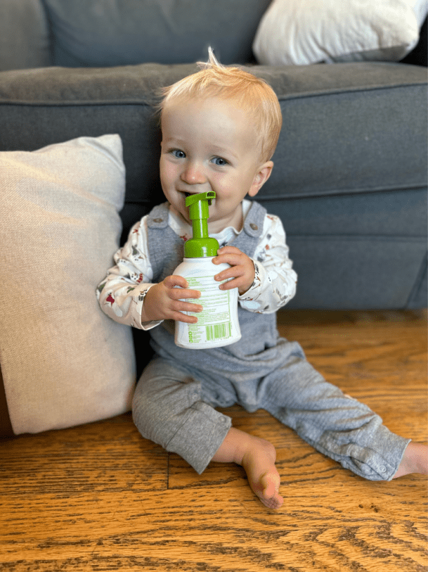 Baby boy sitting on floor