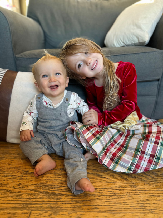 Brother and sister in Christmas clothes