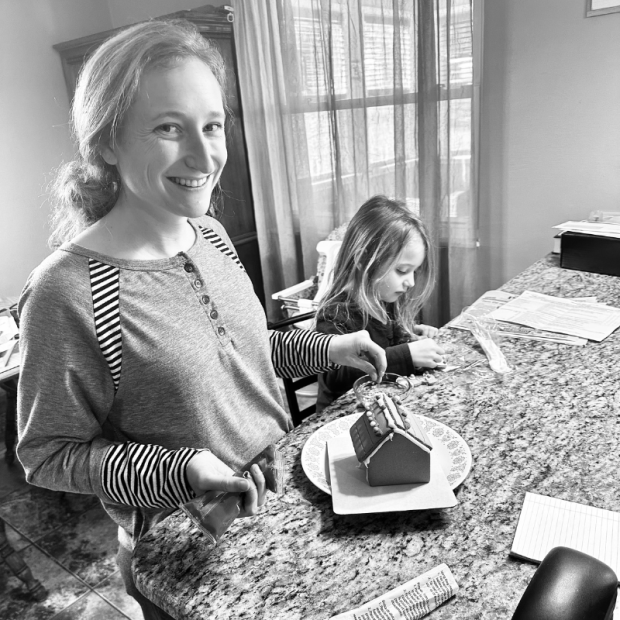 Mom and daughter making gingerbread house