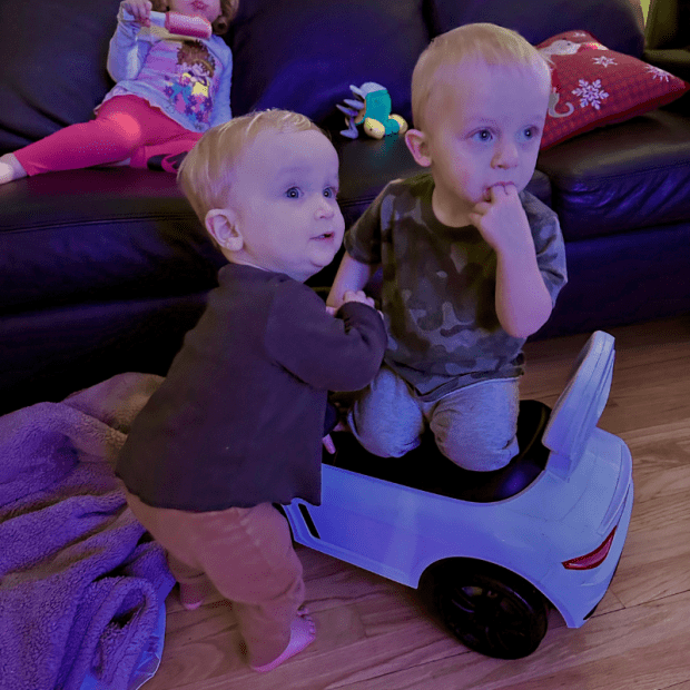 One year old baby boys playing together
