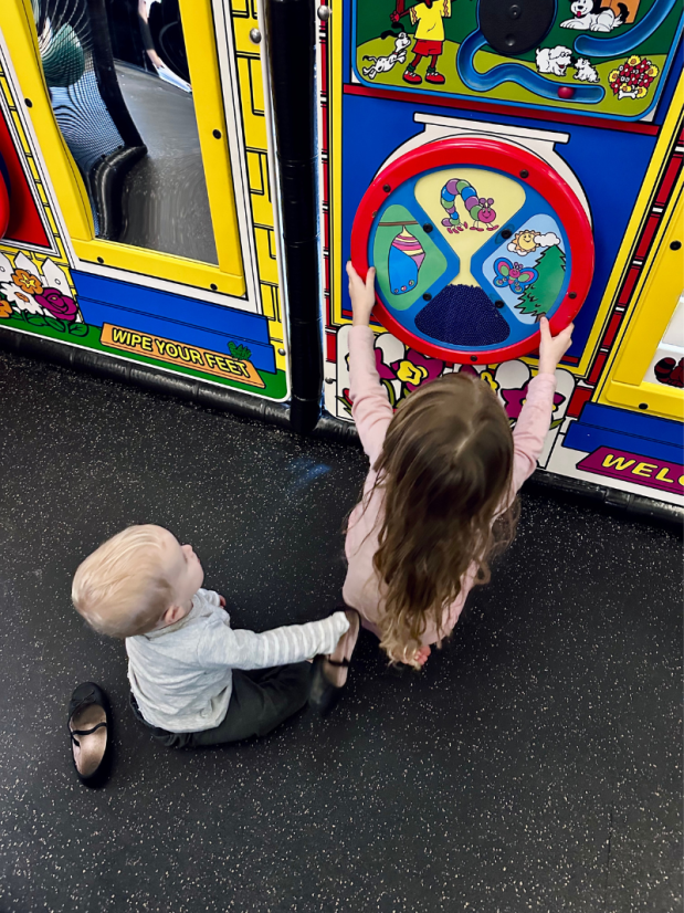 Big sister and baby brother at Chic-Fil-A play place