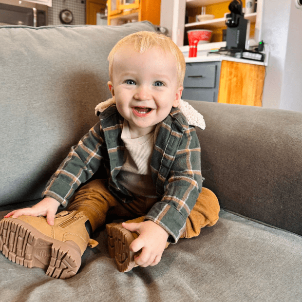 Baby boy sitting on the couch