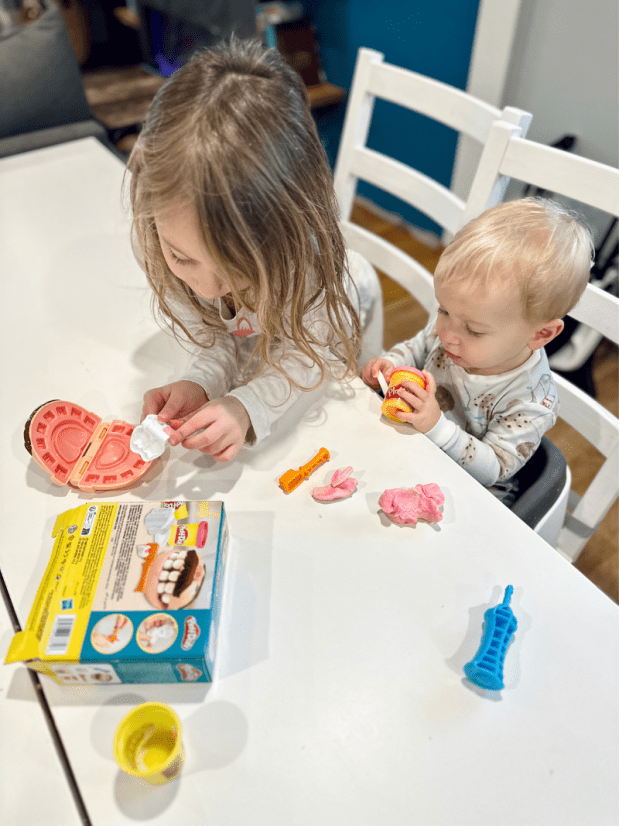 Brother and sister playing Play-Doh