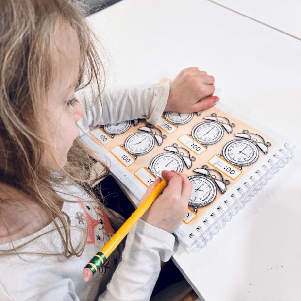 Girl doing The Good and The Beautiful math K 