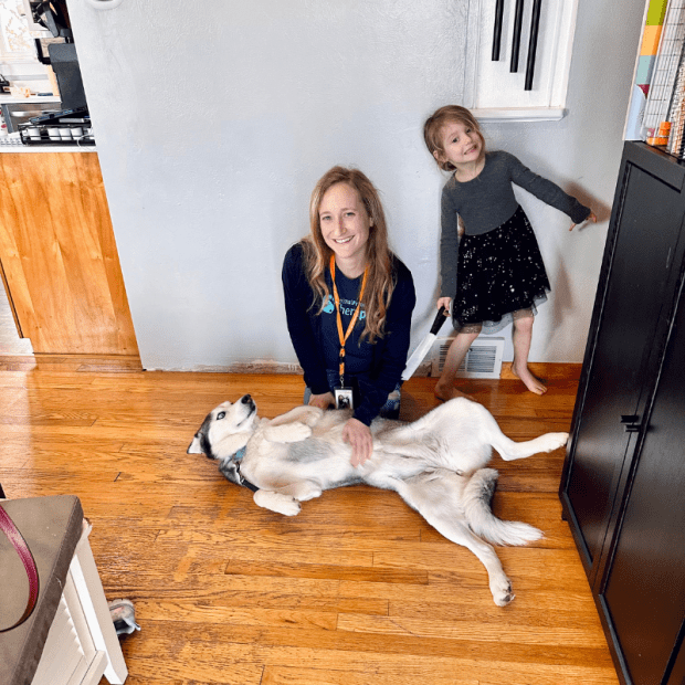 Therapy dog and handler with daughter 