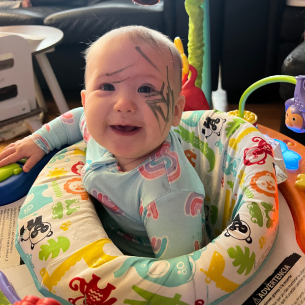 Baby girl with makeup all over her face
