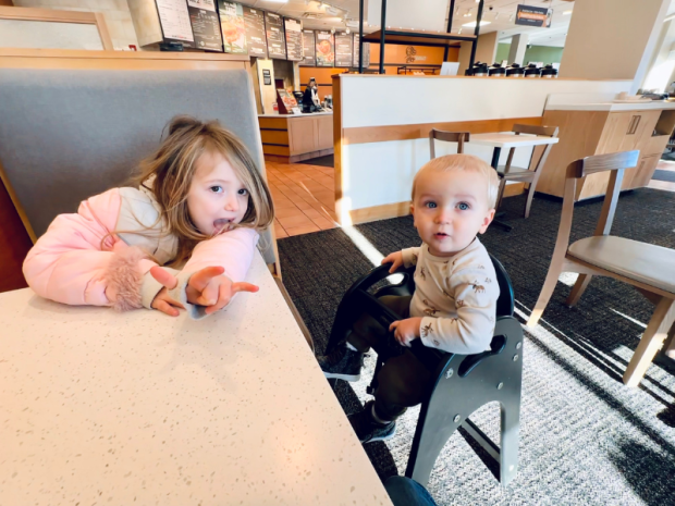 Brother and sister sitting in Panera