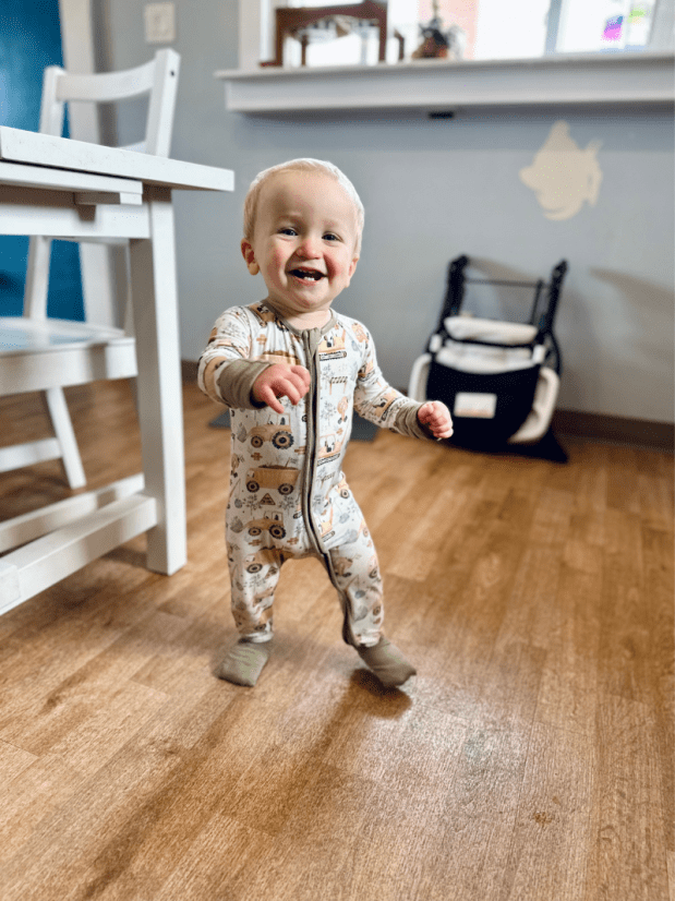 15 month old baby boy walking in kitchen