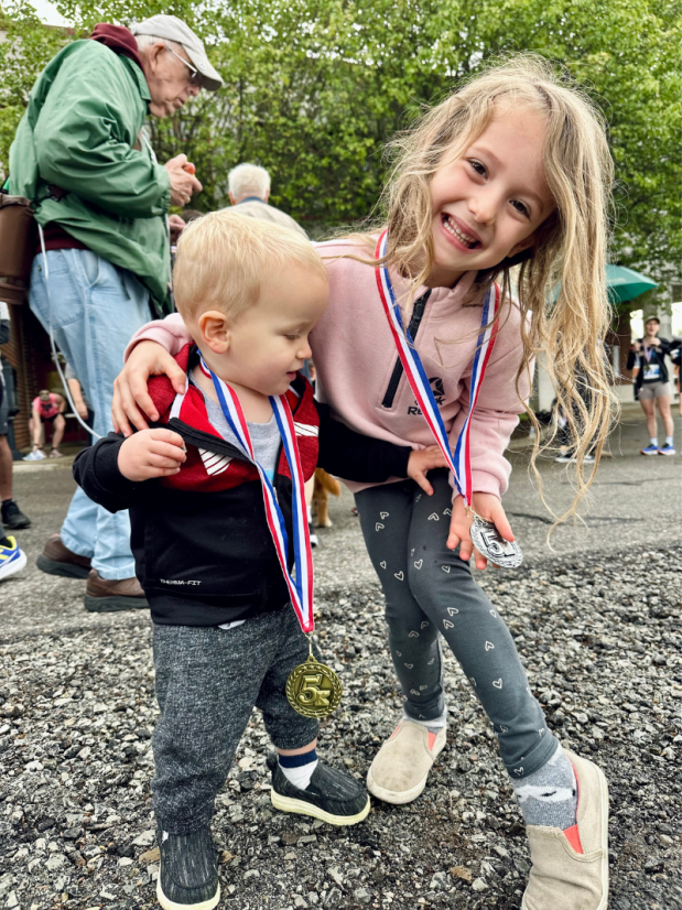 Kids at a 5k with silver and gold medals