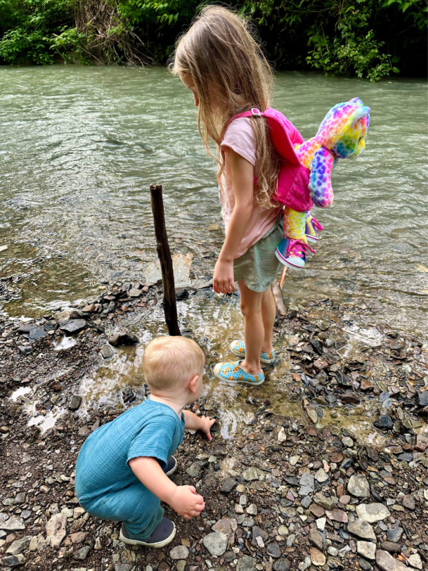 Brother and sister playing at creek in PA