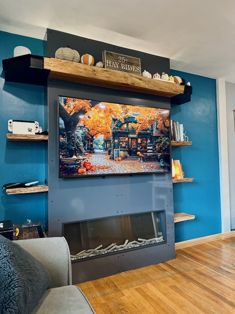 Fireplace and mantle decorated for fall