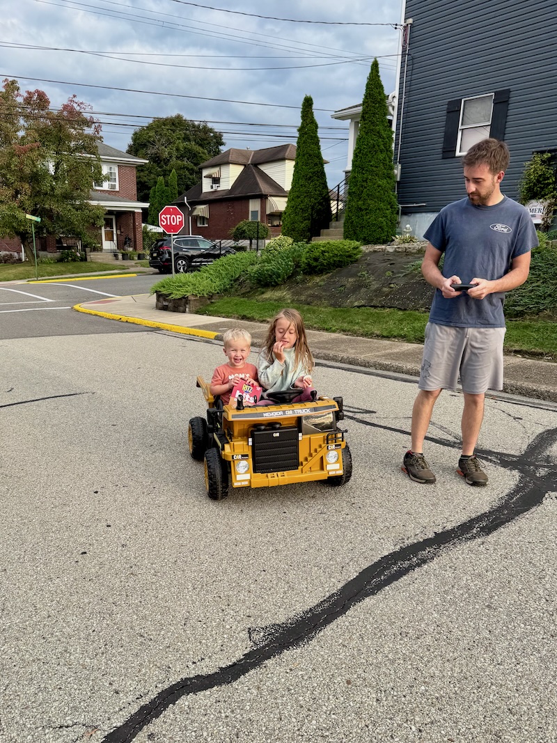Kids riding in a toy dump truck