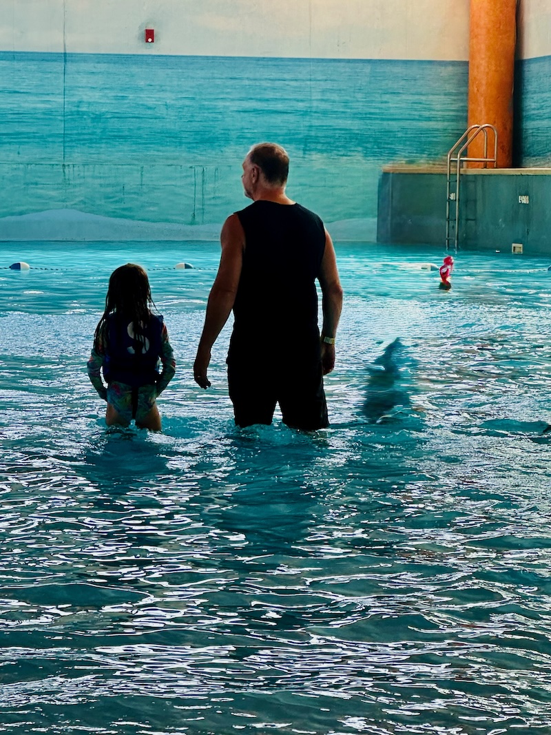 Grandpa and child in wave pool at Splash Lagoon in Erie, PA