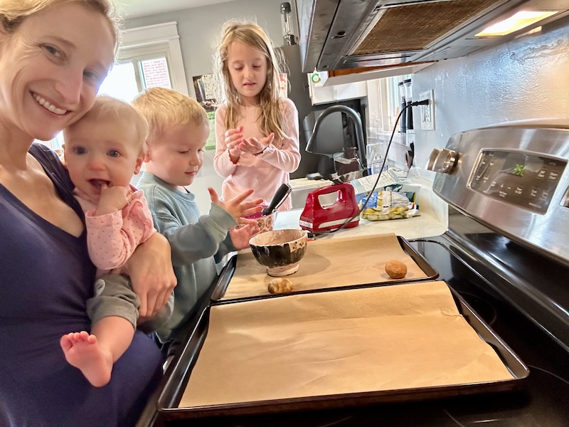 Mom and kids baking together