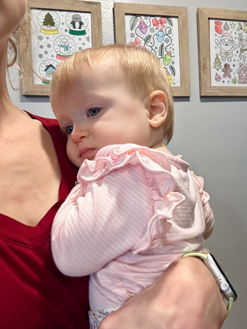 Baby girl in pink ruffle bodysuit