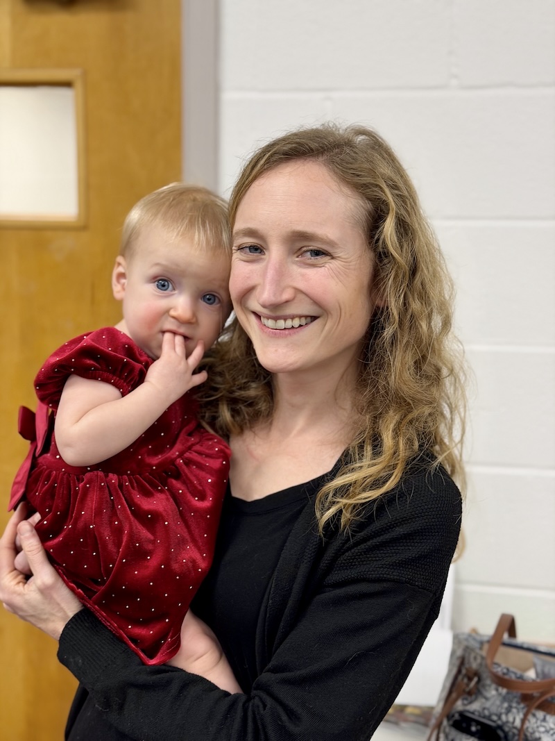 Mom holding baby girl