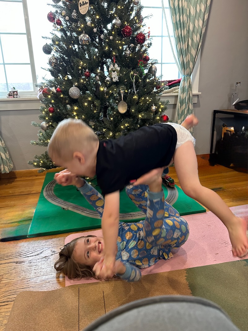 Kids doing acro yoga