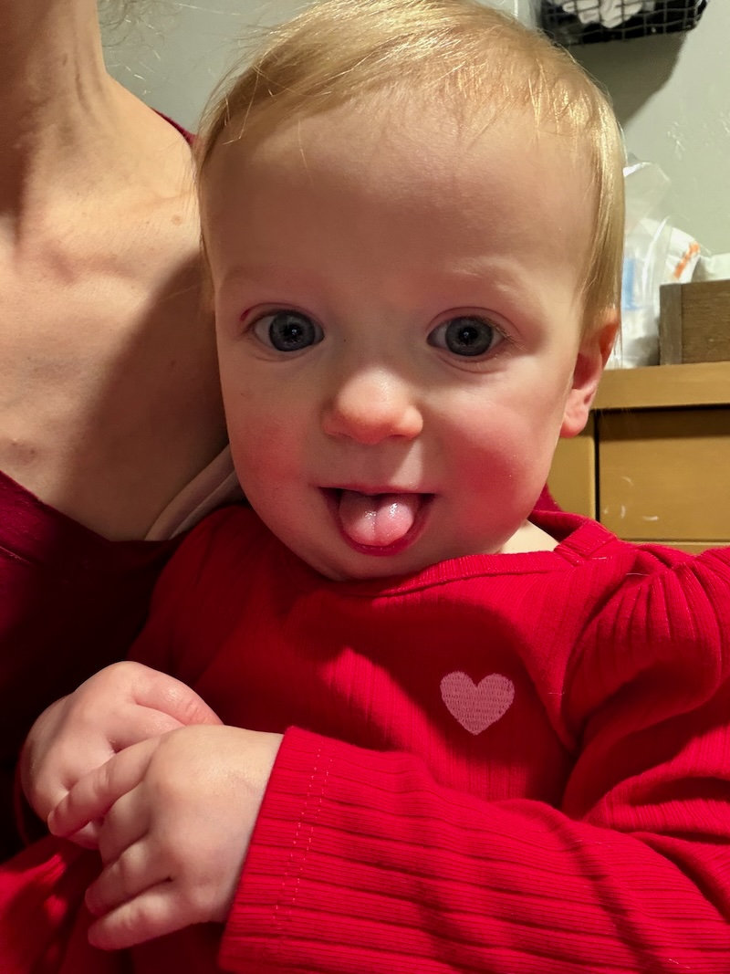 Baby girl sticking her tongue out