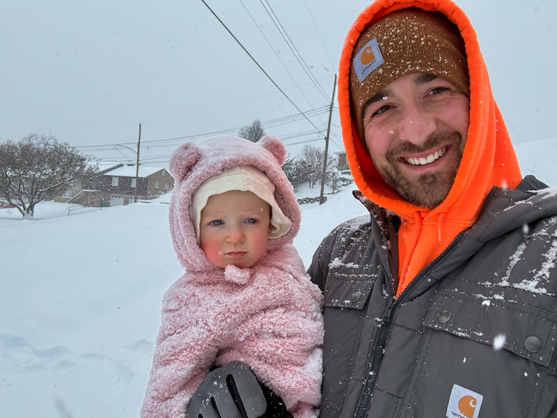 Dad and baby in the snow