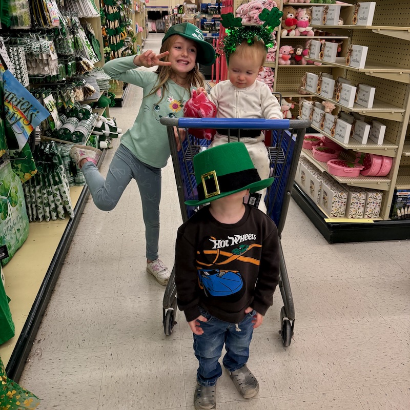 Kids wearing St. Patrick's Day accessories in Hobby Lobby