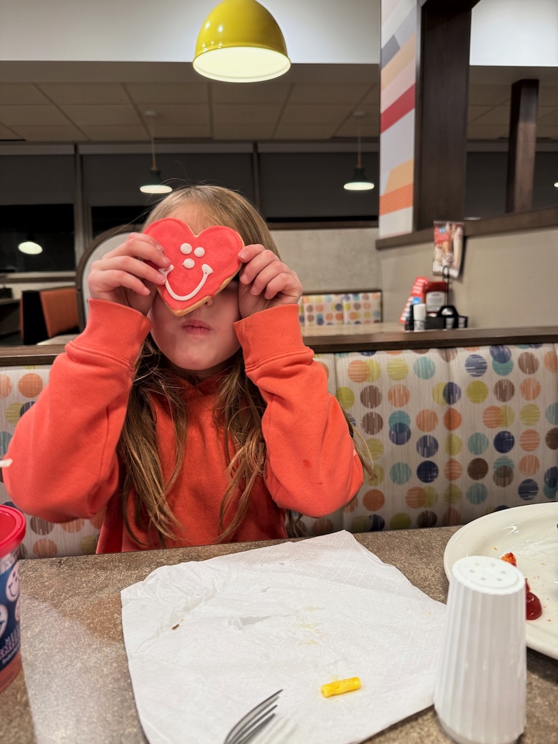 Girl with heart smiley face cookie at Eat'n Park in Pittsburgh, PA