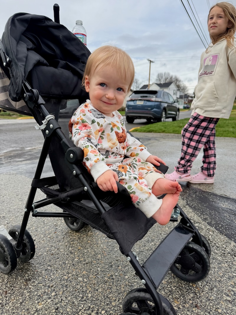 Baby girl sitting in stroller