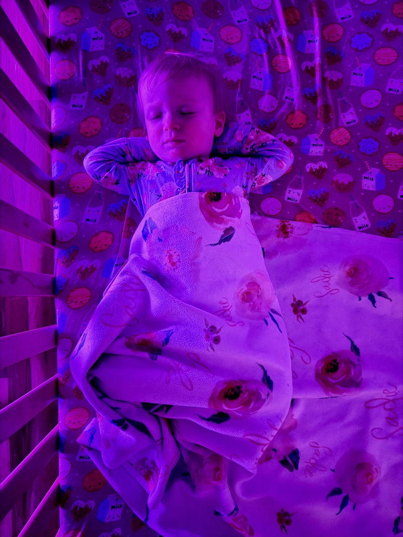 Baby sleeping on back in crib