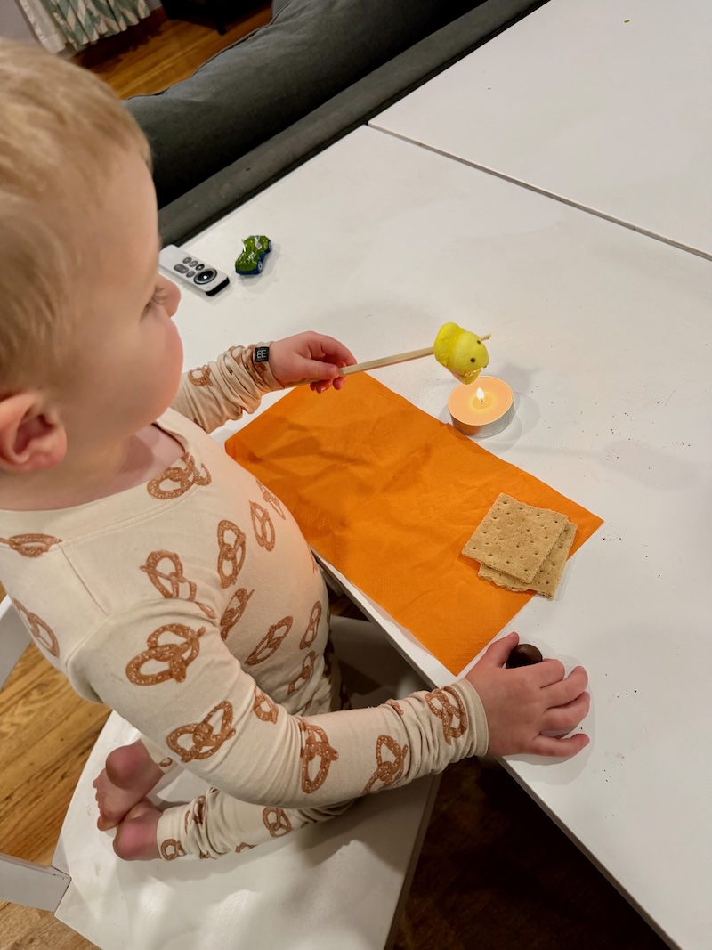 Toddler boy making indoor s'mores