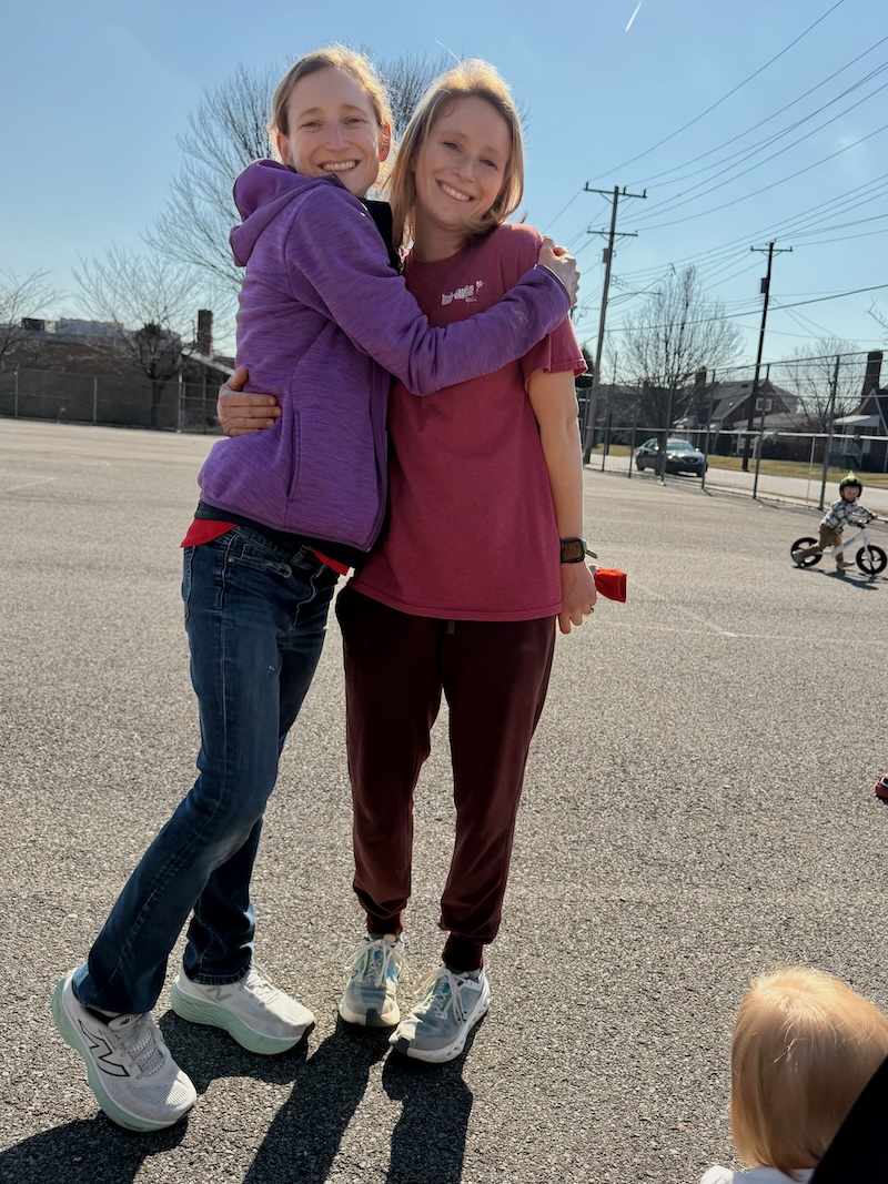 Sisters hugging at park