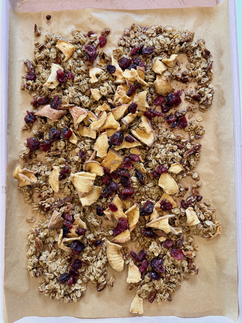 Maple apple granola on baking pan