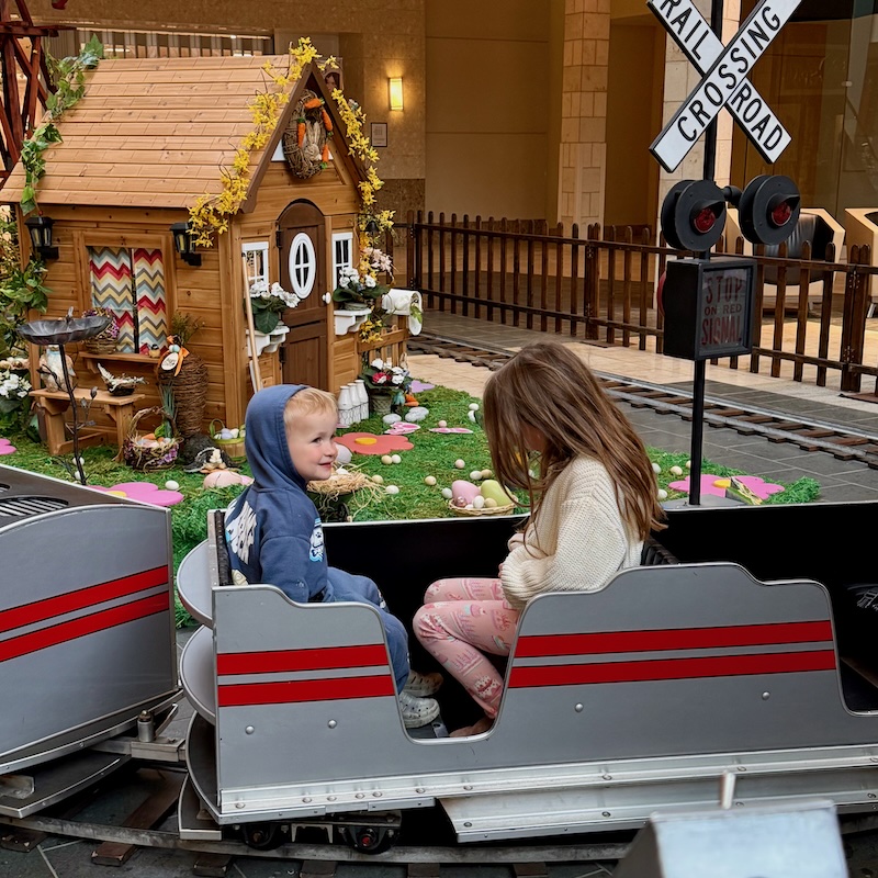 Toddler boy and girl on train