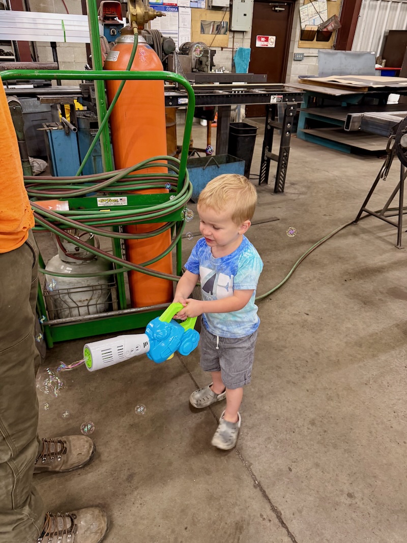 Boy with bubble leaf blower