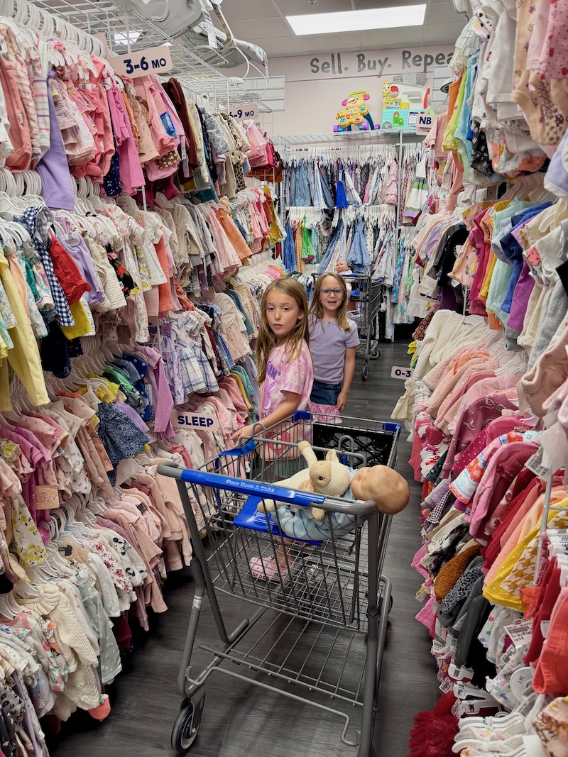 Girls shopping at Once Upon a Child