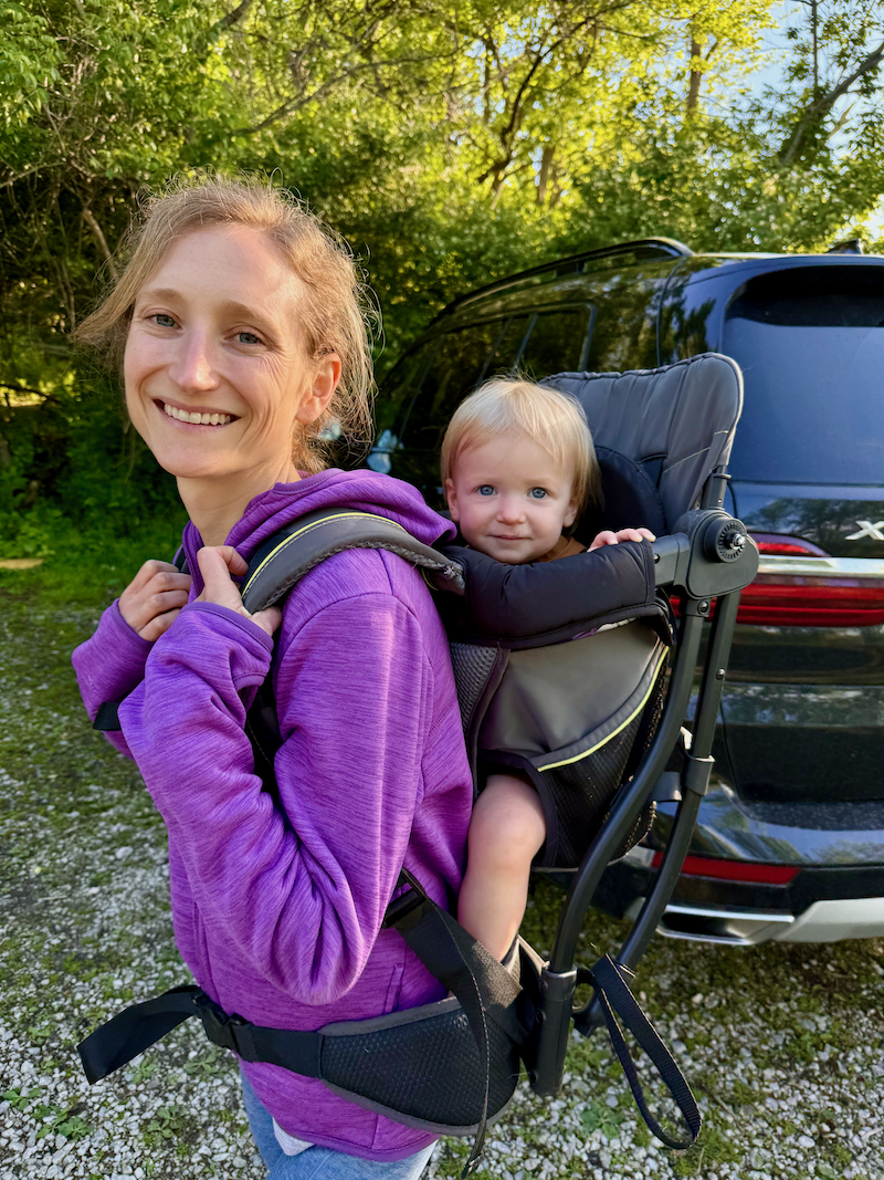 Mom with baby in hiking backpack