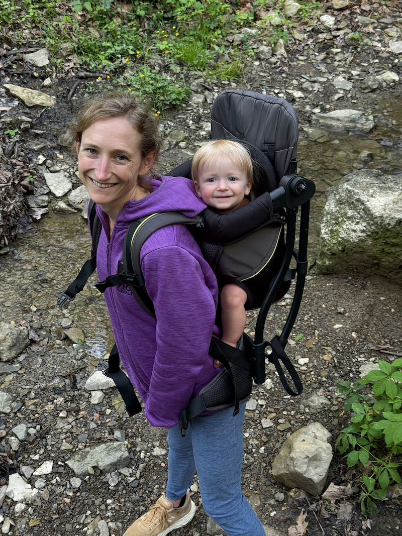 Mom with baby in hiking backpack