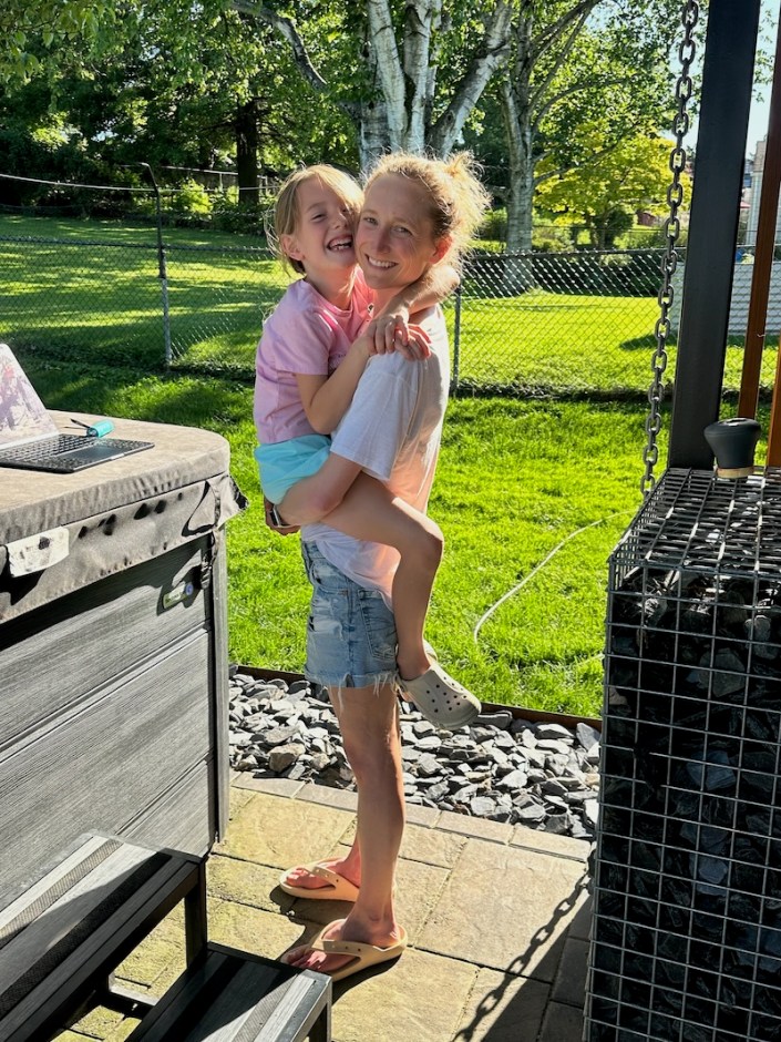 Mom holding daughter