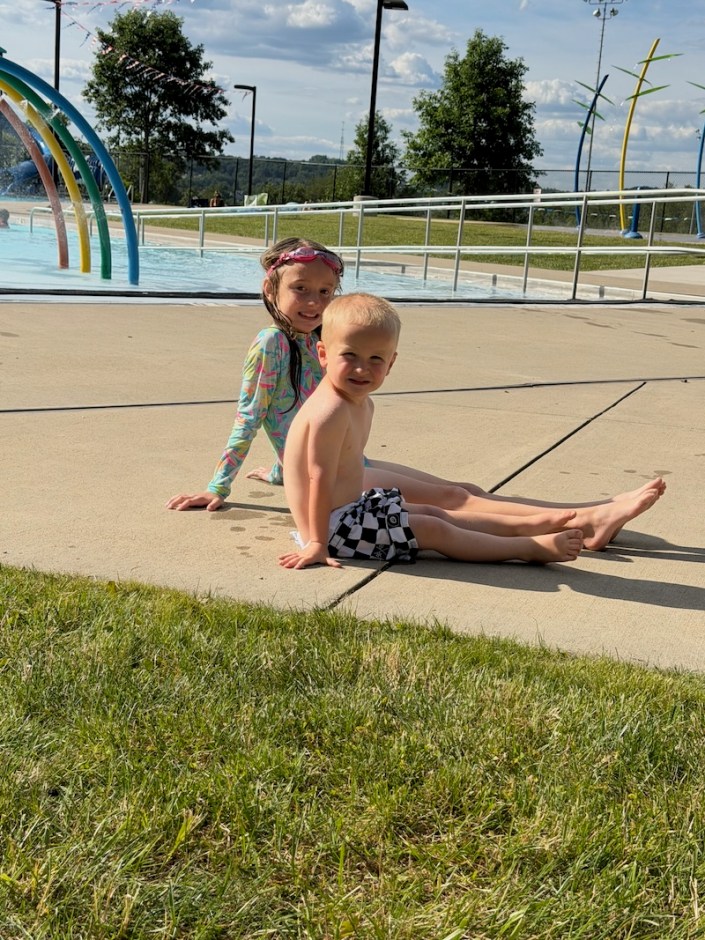 Kids sitting at pool