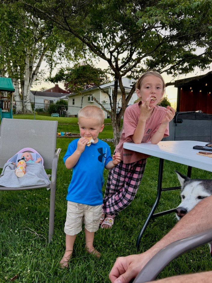 Kids eating s'mores