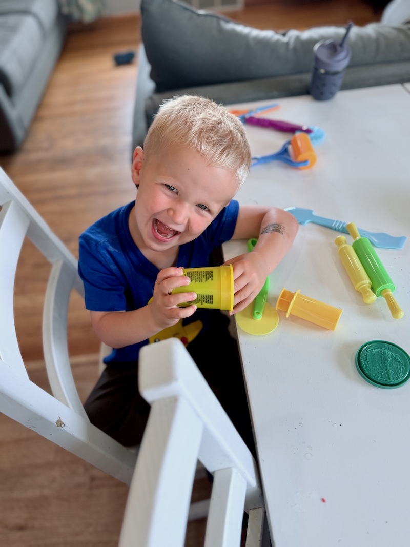Toddler boy playing with Play-Doh