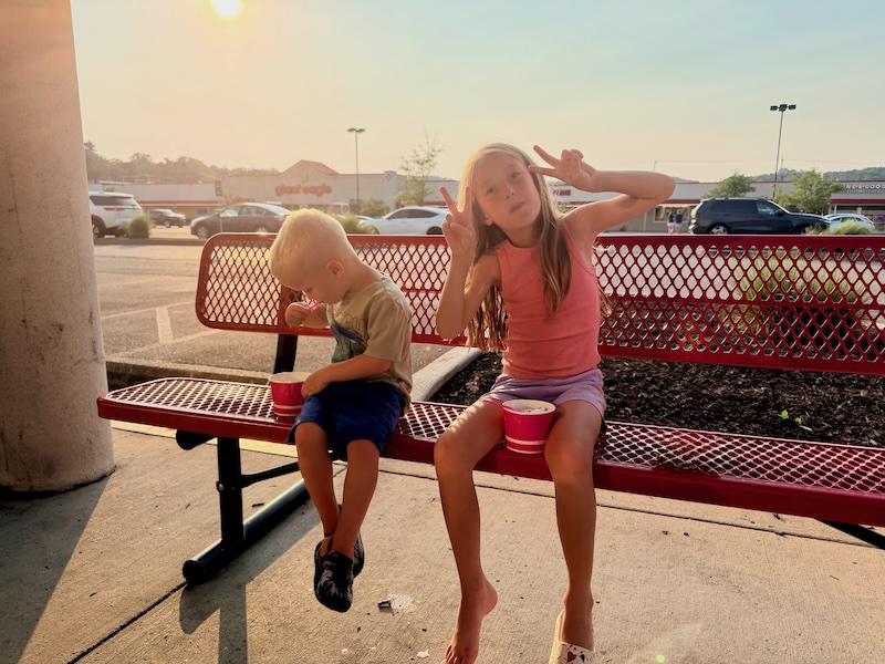 Kids eating frozen yogurt outside