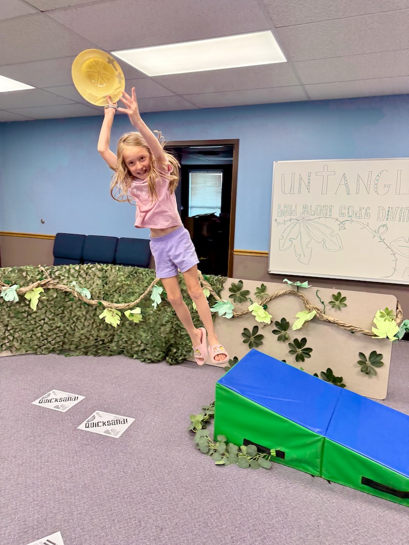 Girl jumping off mat