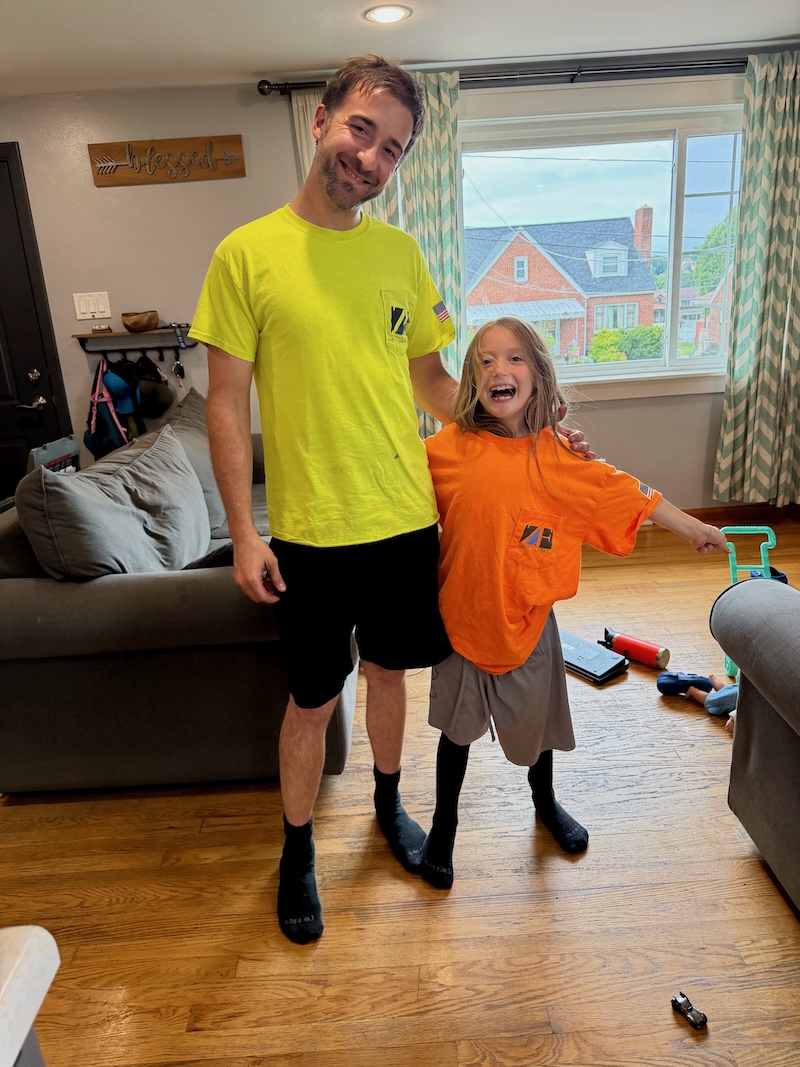 Girl wearing dad's clothes