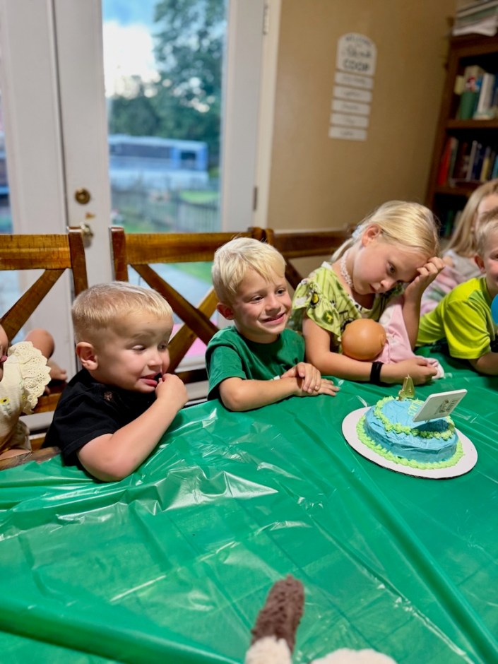Boy smiling with birthday cake