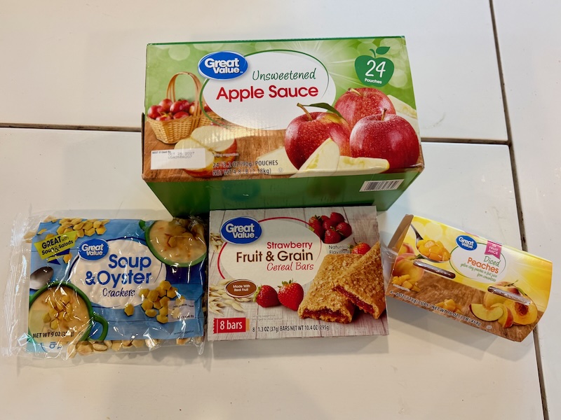 Applesauce, oyster crackers, granola bars, and peaches from Walmart