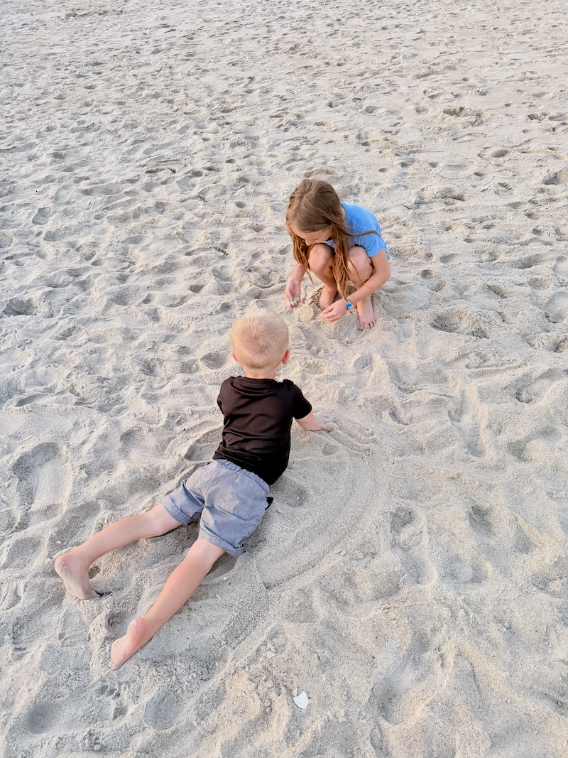 Kids catching crabs on the beach in Nags Head, NC