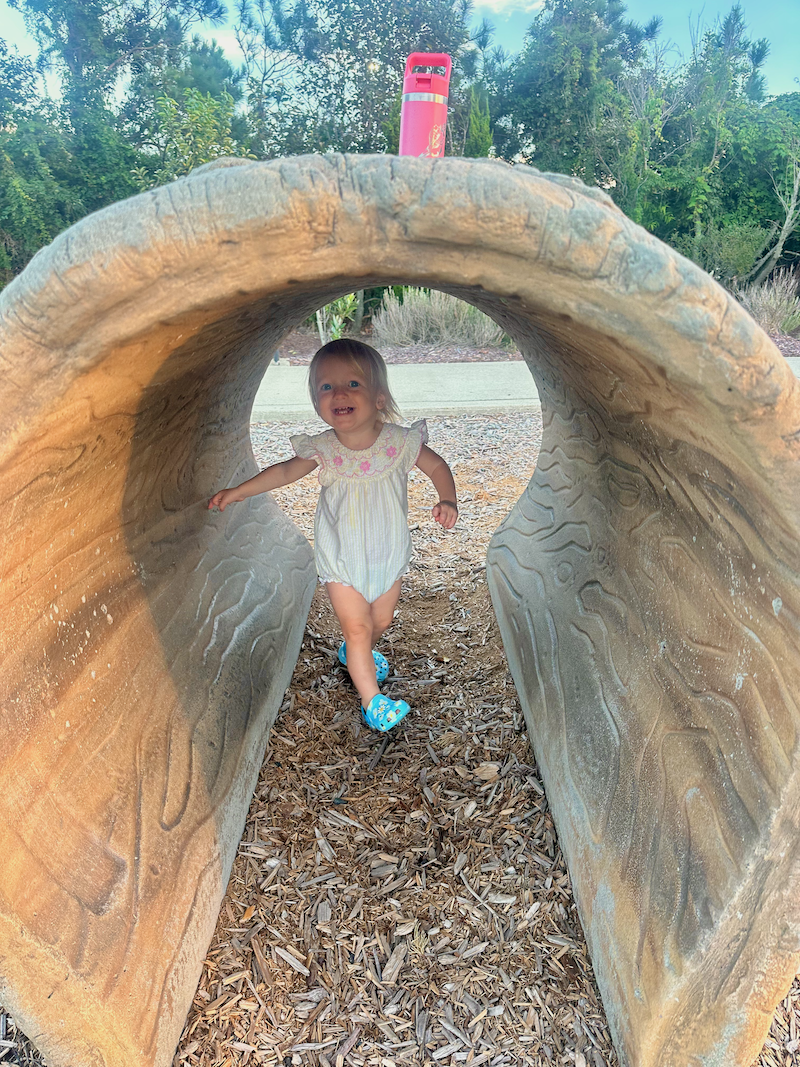 Toddler girl playing at Dowdy Park in Nags Head, NC
